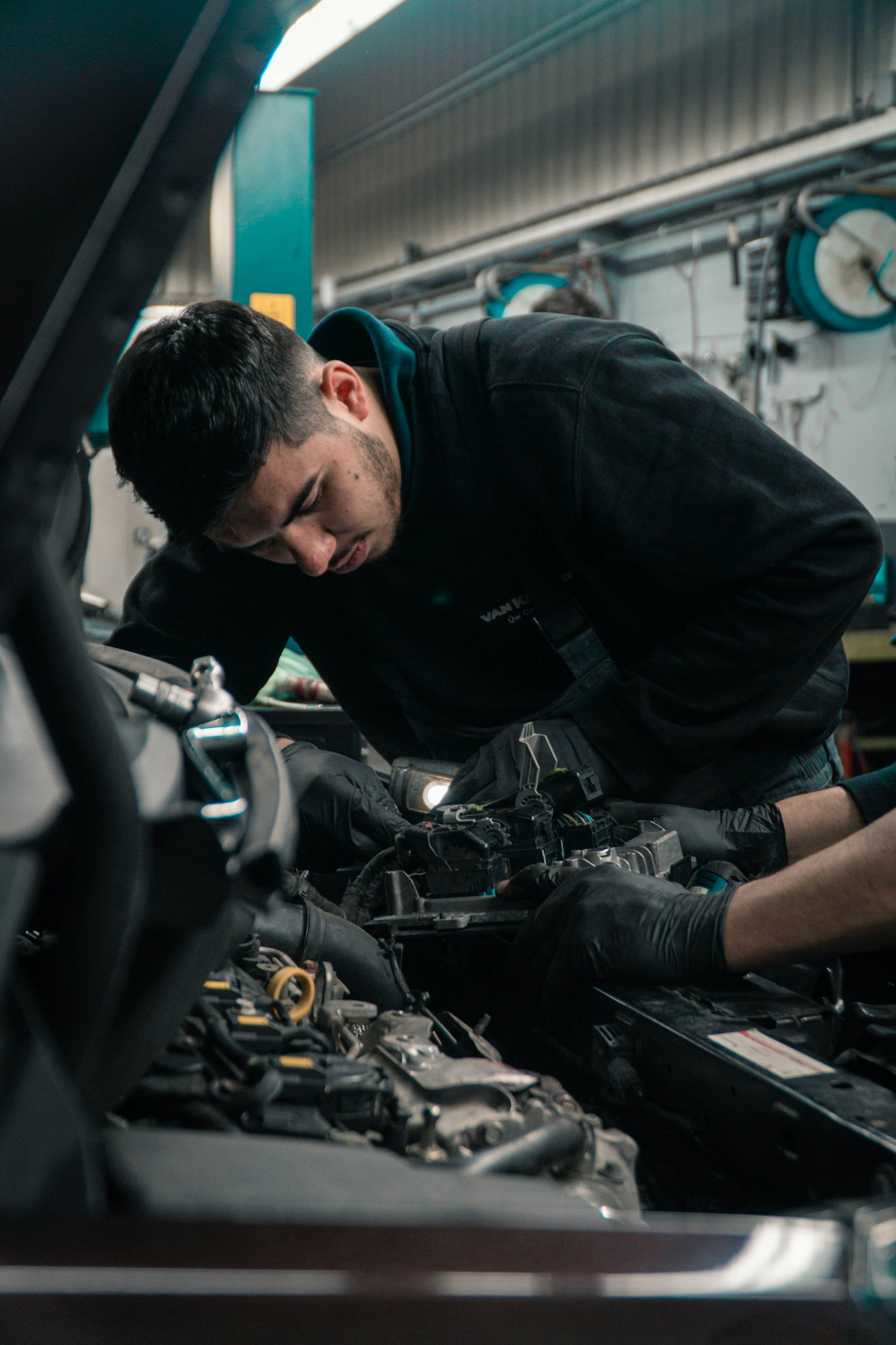 A mechanic working in an auto repair shop