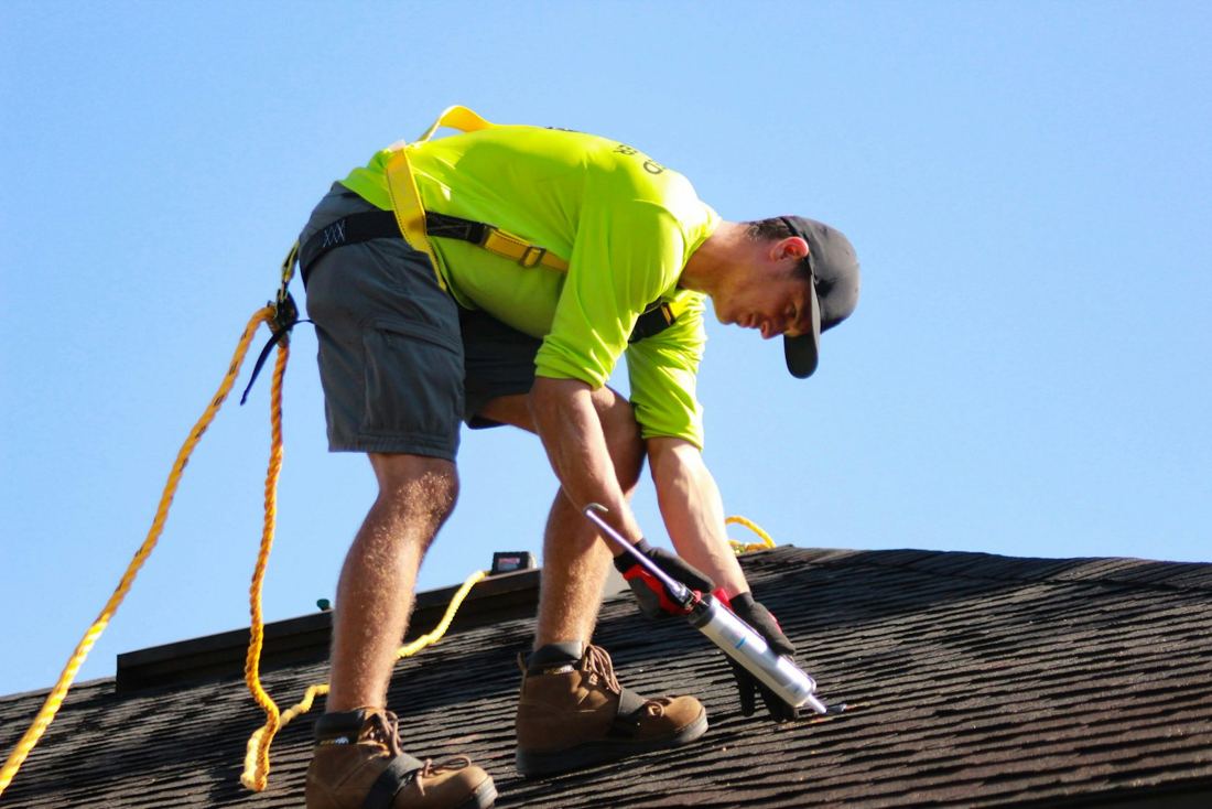 A roofing crew at work on a rooftop